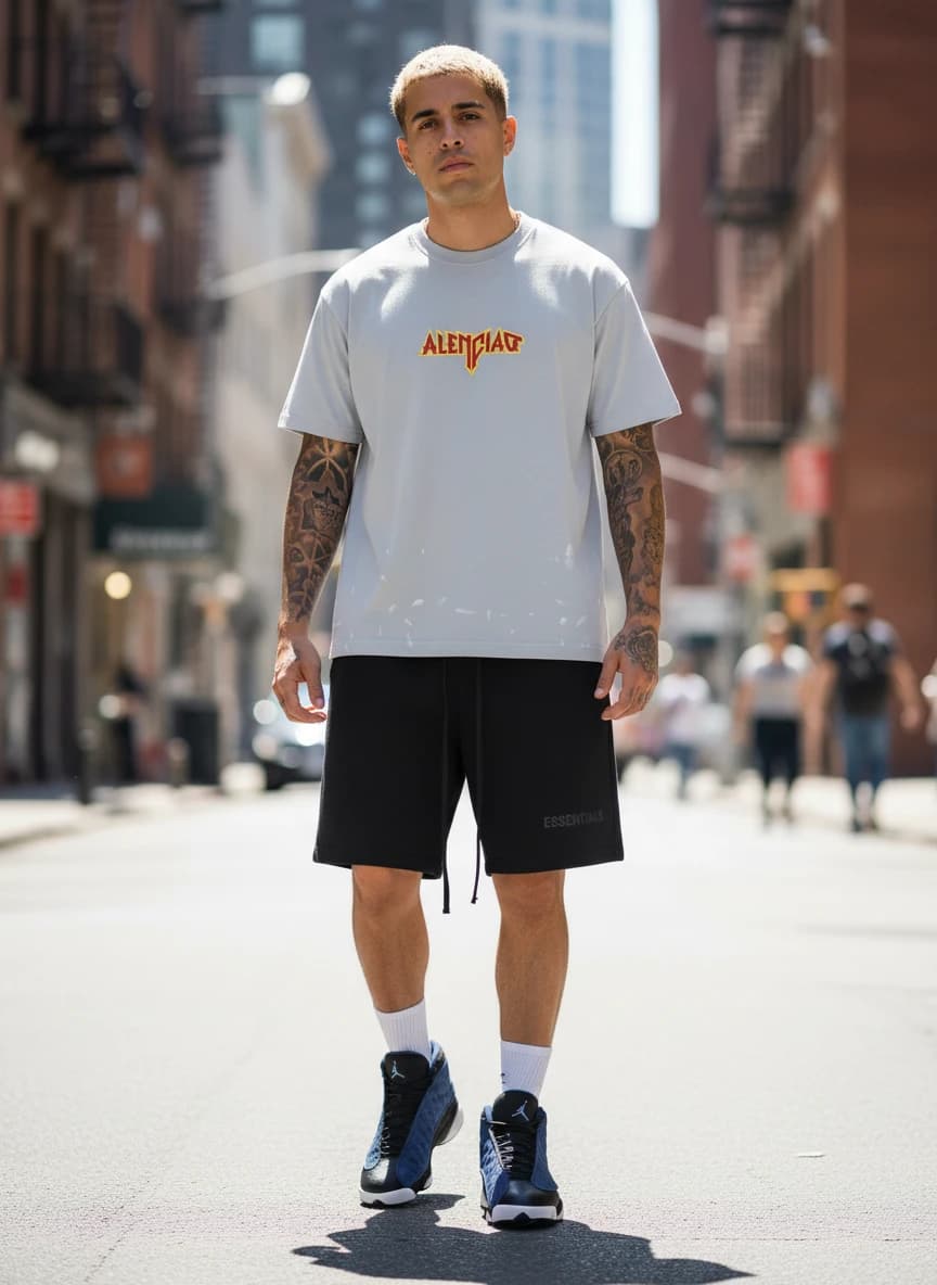 Lencity Alenciag Oversized T-Shirt in Grey, Fear of God Essentials Black Drawstring Shorts, Air Jordan 13 Retro Sneakers in Blue and Black